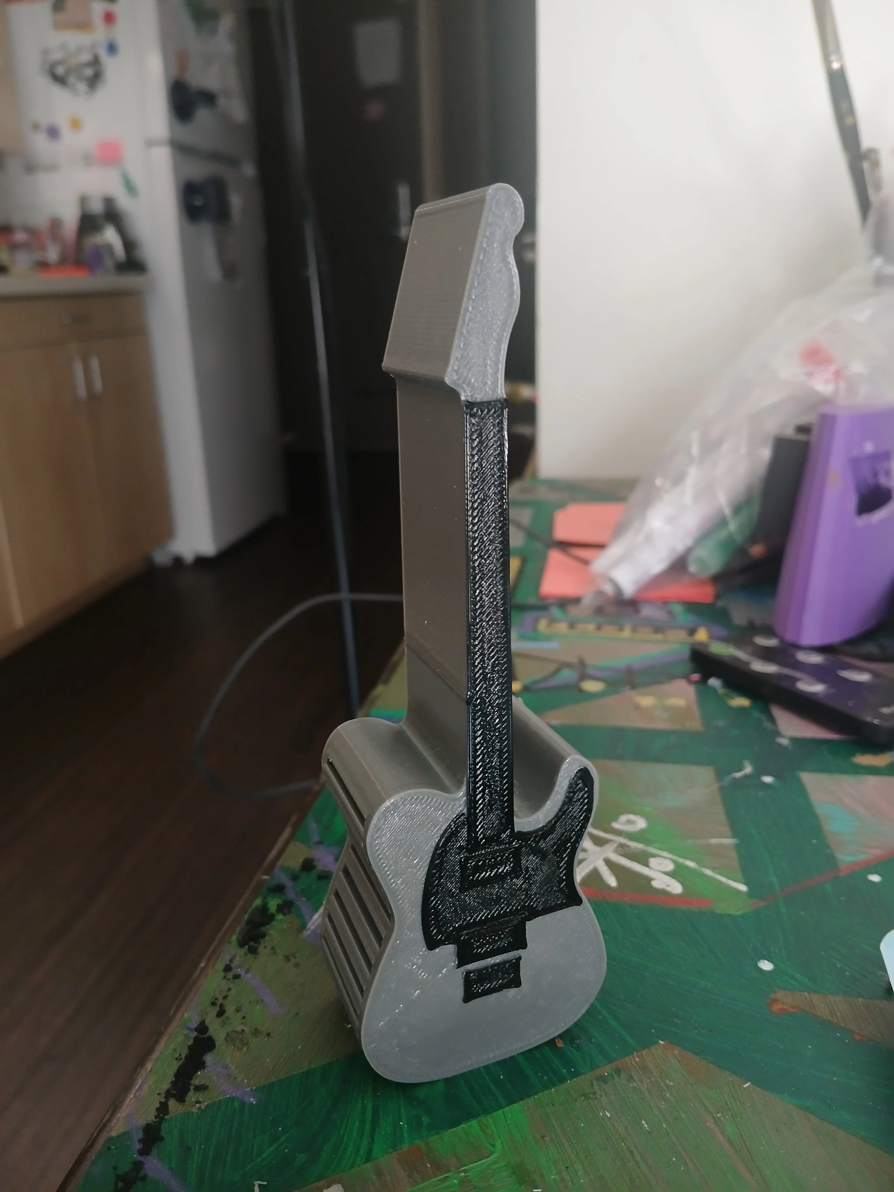 Telecaster-style guitar pick holder in gray 3D-printed plastic to keep picks organized
