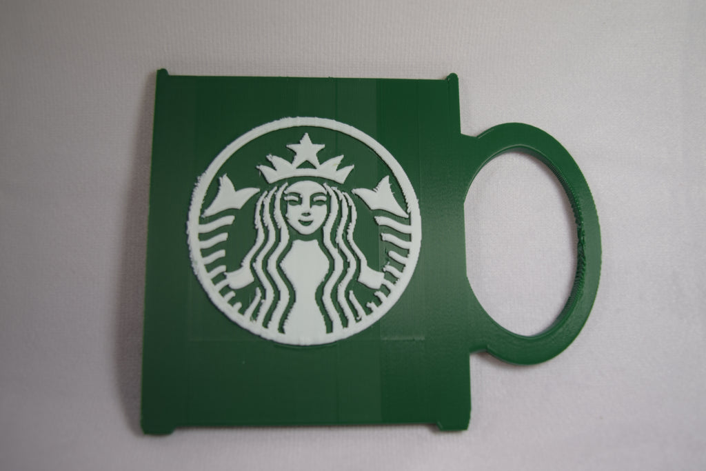 Starbucks mug gift card holder, green 3D-printed with white Starbucks logo and built-in handle.