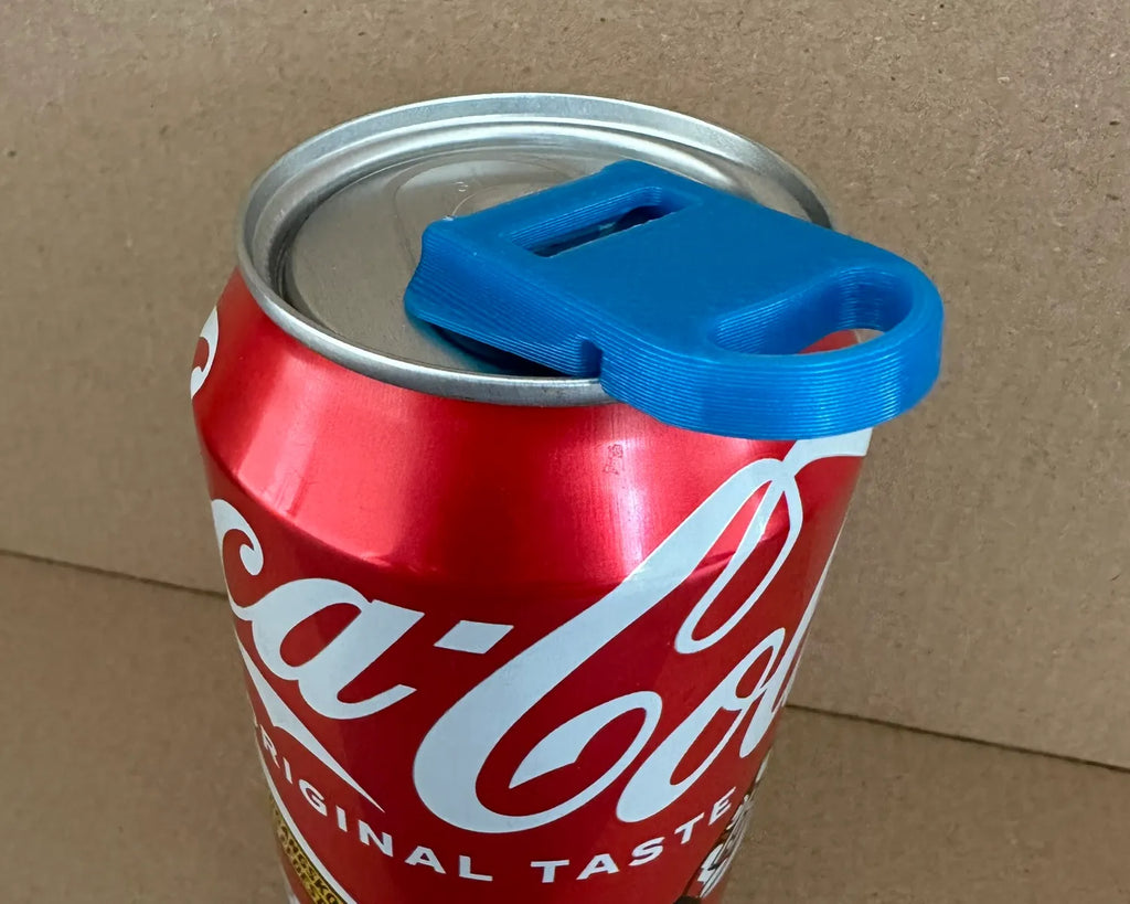 2-in-1 Soda Can Opener & Lid, blue reusable can cover attached to a red Coca-Cola can