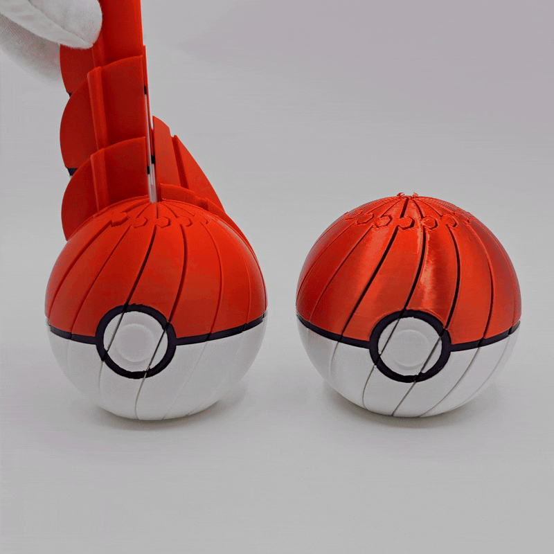 Pokéball Twist Fidget; two red-and-white Pokéball spheres, pocket-sized sensory toy
